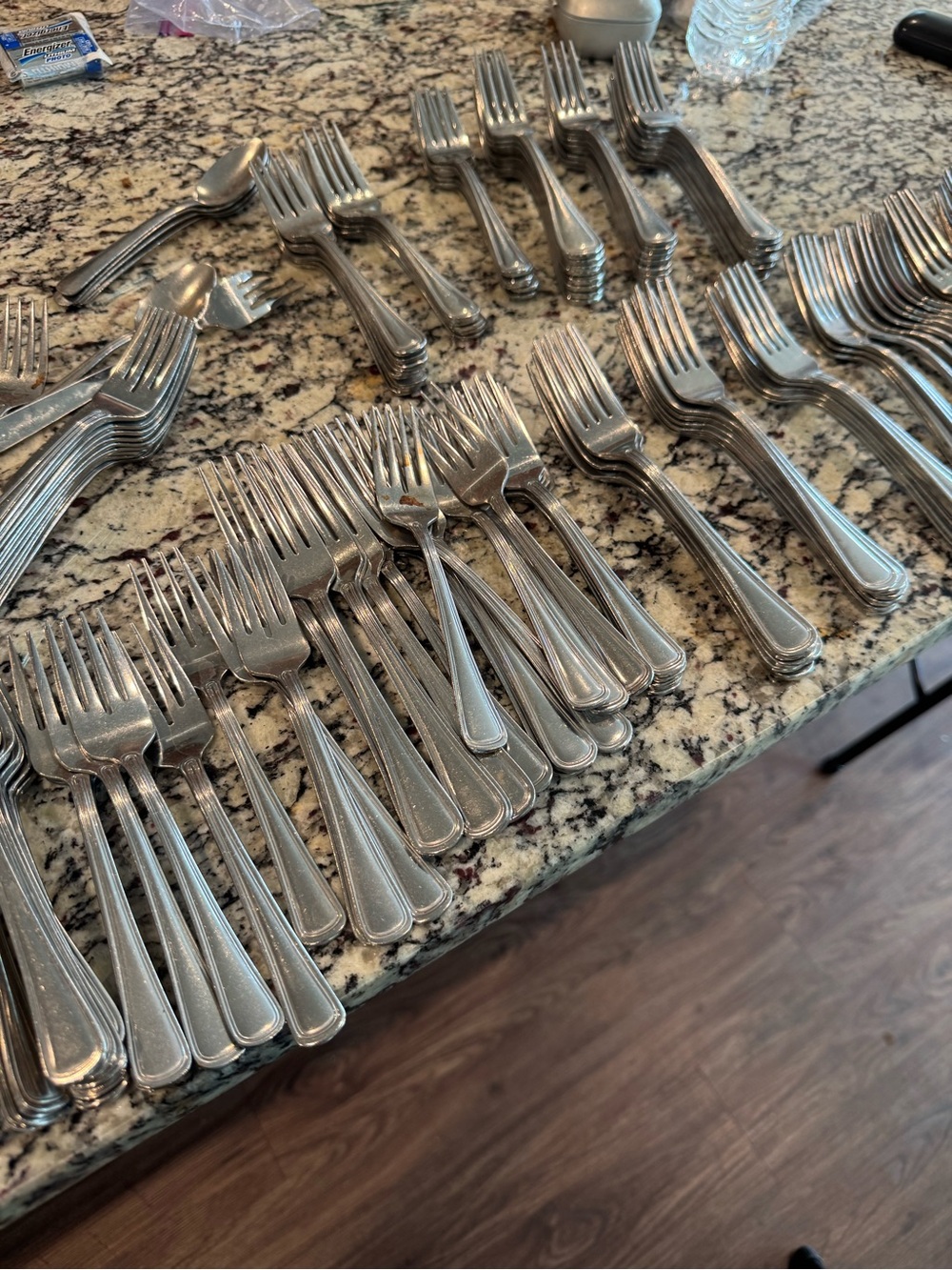 100+ assorted stainless steel forks and knives